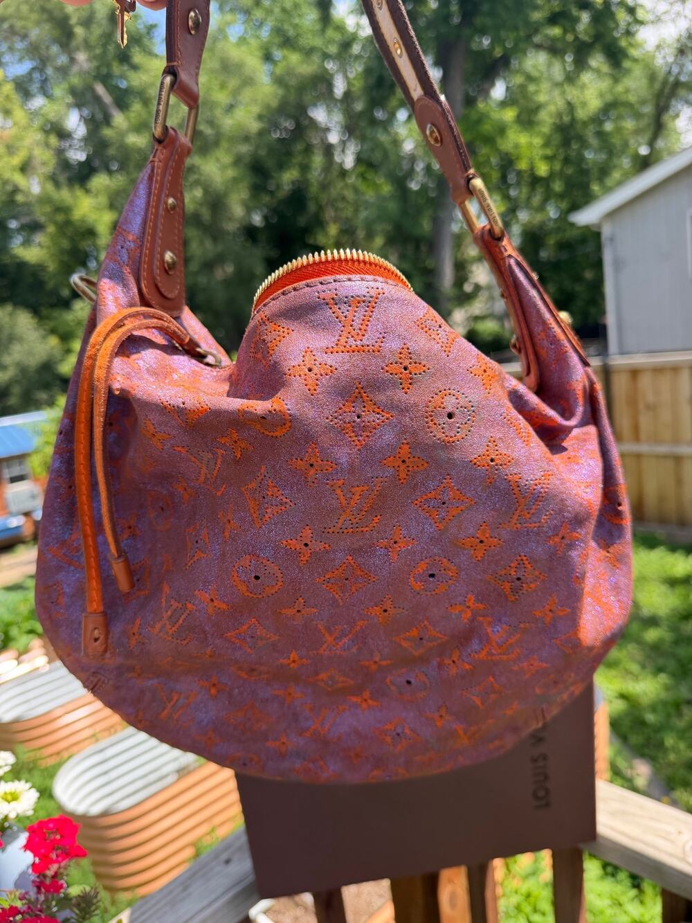 LOUIS VUITTON Runway 
Limited Edition Metallic Leather Onatah GM Bag